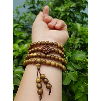 Vòng đeo tay nữ gỗ trầm mix bông hoa sen kiểu quấn tay 4 vòng may mắn tài lộc  Size hạt 6mm  Màu vàng nâu vân sáng nhẹ đeo tay rất đẹp xinh mùi thơm nhẹ nhẹ ạ